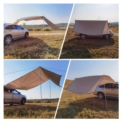 Tenda cinzenta montada em carro cinzento em área campestre