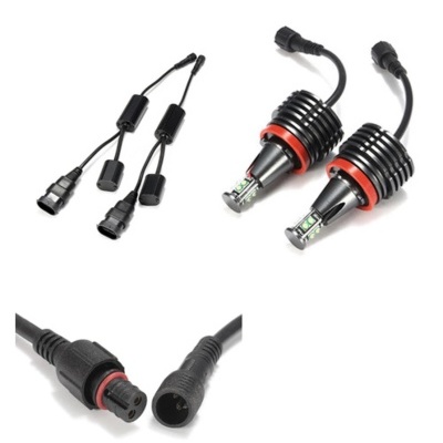 Lâmpadas LED para automóveis com dissipadores de calor e cabos elétricos pretos sobre fundo branco.