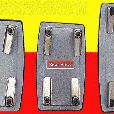 Três suportes metálicos retangulares com parafusos em fundo amarelo e vermelho