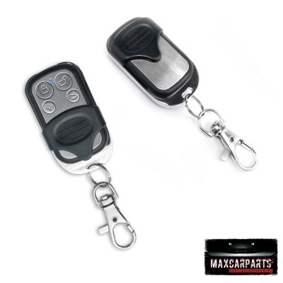 Dois comandos remotos para automóveis com plástico preto e metal cromado, um com quatro botões cinza e outro com capa preta deslizante