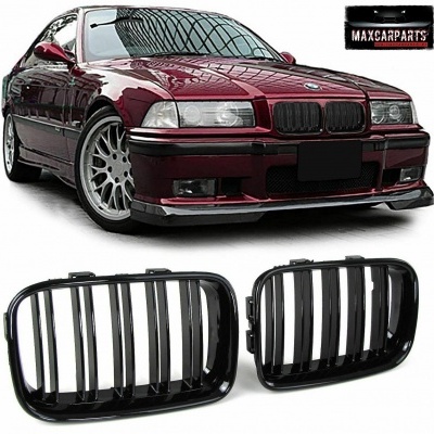 Carro BMW vermelho com grelha preta e peças de grelha em destaque