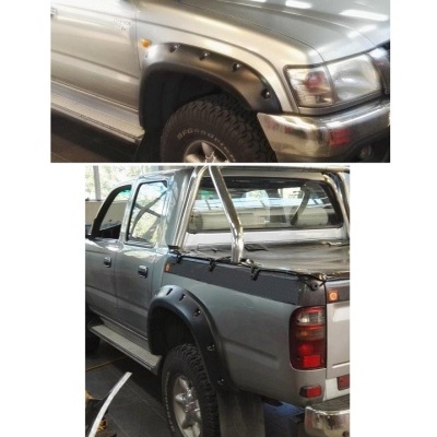 Pick-ups prata com abas de guarda-lamas pretas e barras cromadas interiores