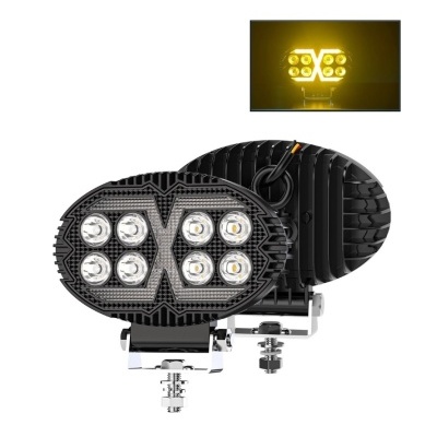 Par de faróis LED ovais pretos com luz amarela ligada