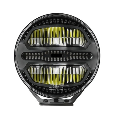 Farol redondo preto com lentes transparentes e refletores amarelos e prata
