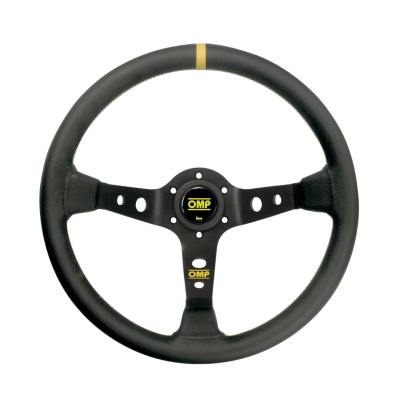 Volante de competição OMP preto com três raios perfurados e detalhe amarelo no topo.