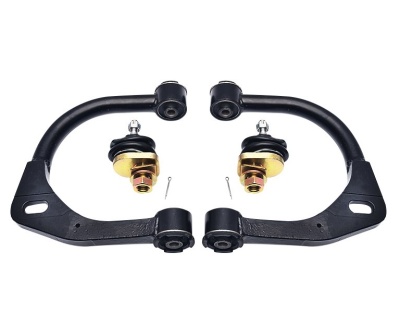 Conjunto de peças automóveis com braços pretos e juntas esféricas douradas sobre fundo branco