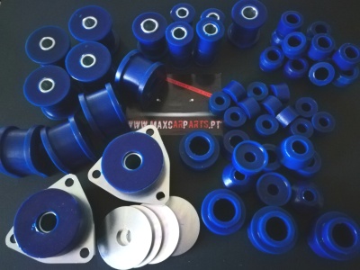 Conjunto de buchas azuis de vários tamanhos sobre superfície escura com texto WWW.MAXCARPARTS.PT ao fundo