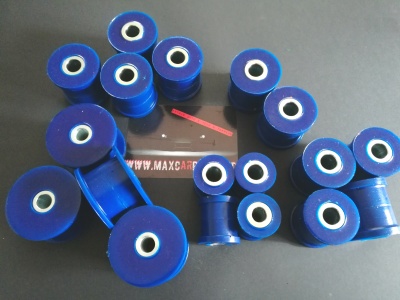 buchas cilíndricas azuis com núcleo branco sobre superfície cinzenta e cartão preto com texto