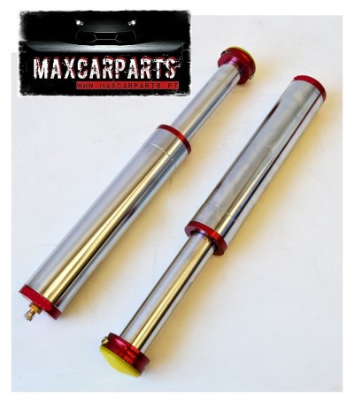 Duas molas amortecedoras metálicas com extremidades vermelhas e tampa amarela junto a cartaz MAXCARPARTS.