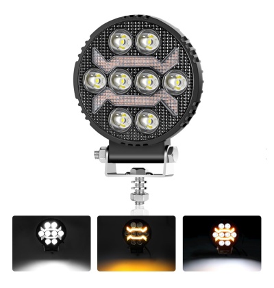 Farol redondo preto com LEDs e setas de luz âmbar em suporte metálico.
