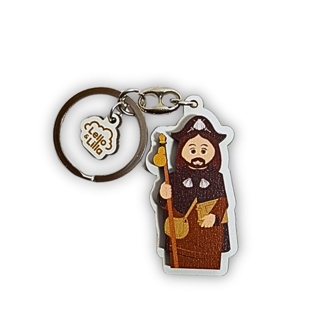 Porta-chaves personagem com roupa castanha e preta e bastão amarelo com pendente metálico Leila e Lilo