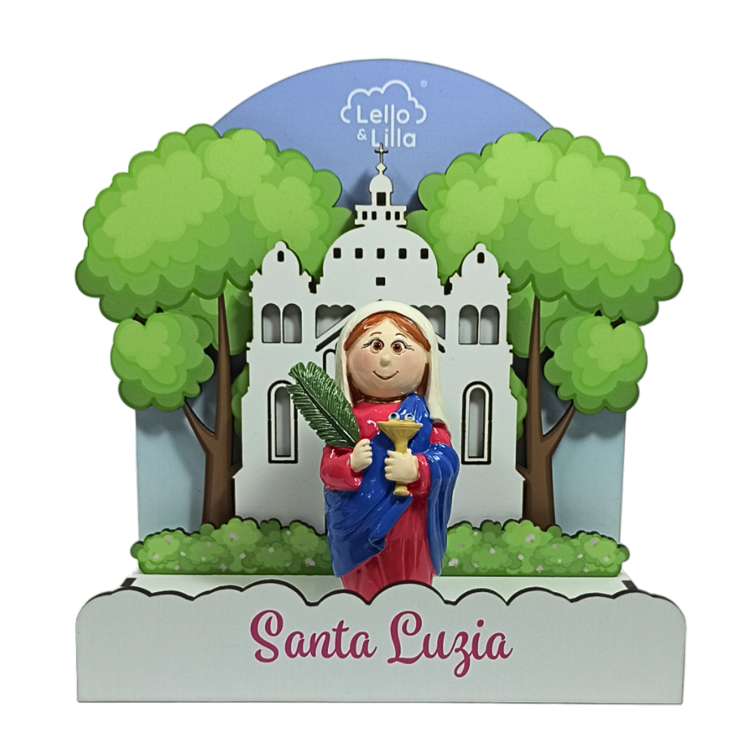 Figura decorativa Santa Luzia com fundo de árvores e edifício branco
