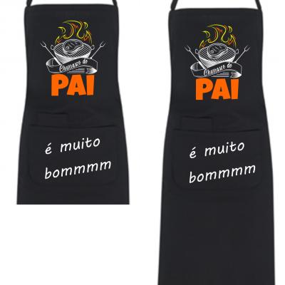 Avental de cozinha preto com desenho de churrasco e texto em português.