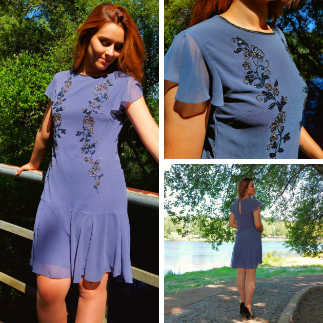 Vestido curto cinza Lipsy London Vestido azul claro com bordados florais pretos usado por mulher ao ar livre junto a lago