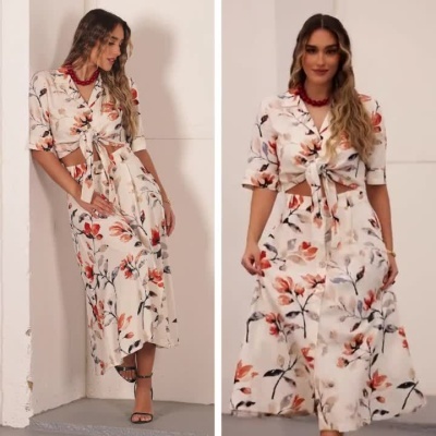 Mulher a usar conjunto floral creme com camisa e saia e acessórios.