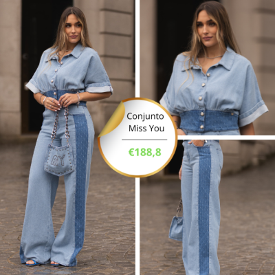 Mulher a vestir conjunto de ganga azul claro e escuro com bolsa azul clara em fundo urbano