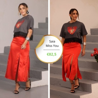 Mulher com top cinzento MISS YOU e saia vermelha com fenda frontal em duas poses em escadas