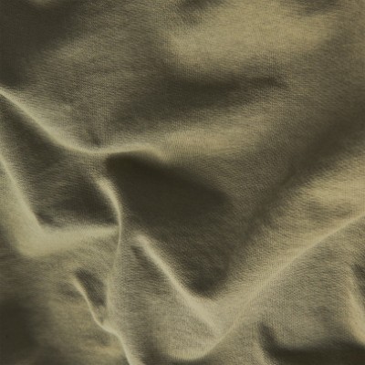 Tecido bege claro com textura e vincos naturais