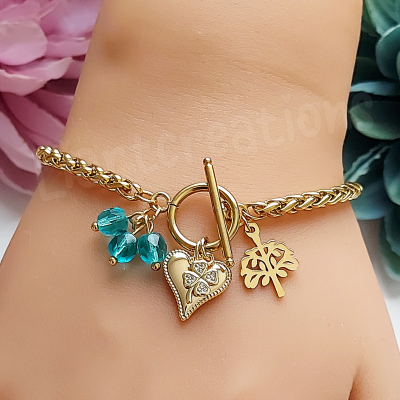 Pulseira dourada com cristais + coração + trevo + árvore da vida