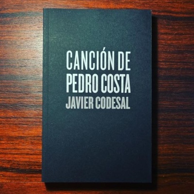 Livro preto com título CANCIÓN DE PEDRO COSTA JAVIER CODESAL