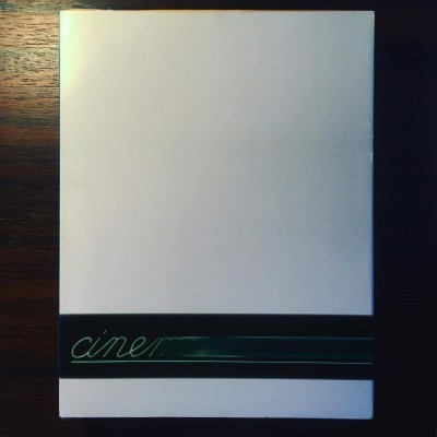 Capa branca com faixa preta e texto 'ciner'