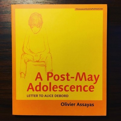 Capa de livro amarelo e laranja com título A Post-May Adolescence