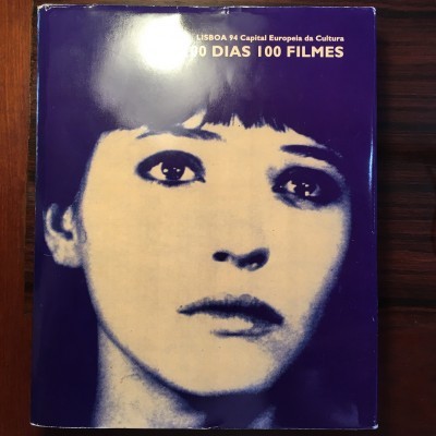 Capa de livro/cartaz com rosto feminino e texto LISBOA 94 Capital Europeia da Cultura 100 DIAS 100 FILMES