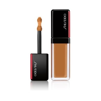 Base líquida Shiseido com aplicador e tampa preta com vermelho