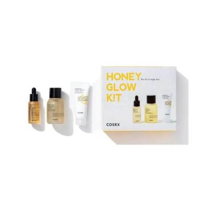 Kit de cosméticos COSRX HONEY GLOW KIT com três frascos e embalagem branca com letras amarelas.