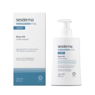 Frasco branco de leite corporal Sesderma com embalagem azul e branca