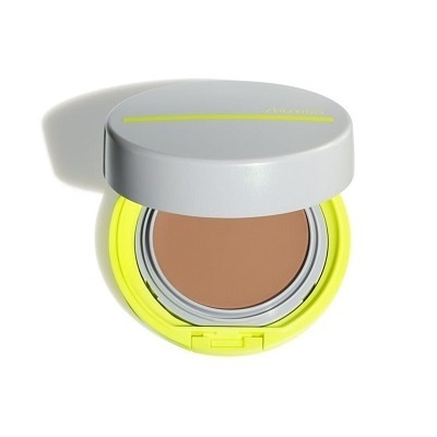 Pó compacto num estojo redondo cinzento e amarelo