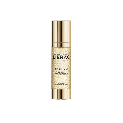 Frasco dourado de cosmético Laboratoires Lierac Premium La Cure.
