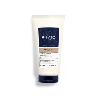 Frasco branco com tampa azul escura de condicionador Phyto Paris.