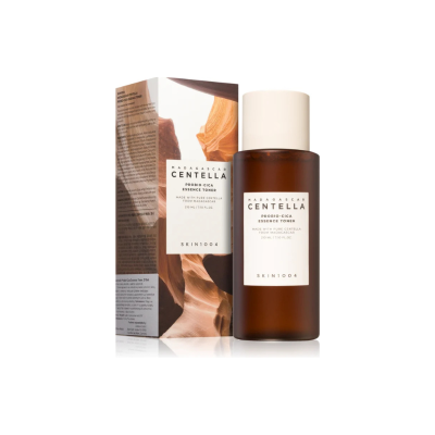 Frasco castanho com tampa branca e caixa com imagem rochosa do SKIN1004 Madagascar Centella Essence Toner