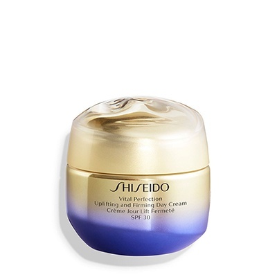 Frasco de creme facial Vital Perfection da Shiseido com tampa dourada e corpo degradê dourado para azul