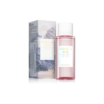 Frasco rosa com tampo branco e embalagem cartonada com imagem de montanha