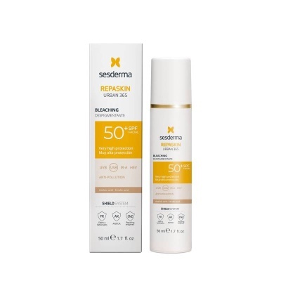 Frasco branco e amarelo de protetor solar Sesderma Repaskin Urban 365 com caixa ao lado