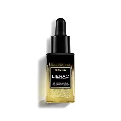 Frasco conta-gotas preto com líquido dourado de sérum cosmetic