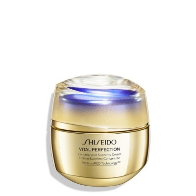 Frasco dourado de creme facial Shiseido Vital Perfection com tampa transparente azul clara