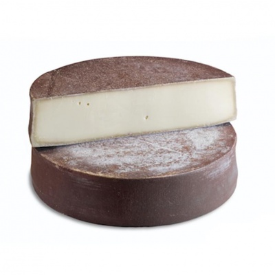 Queijo redondo com casca castanha escura e interior branco