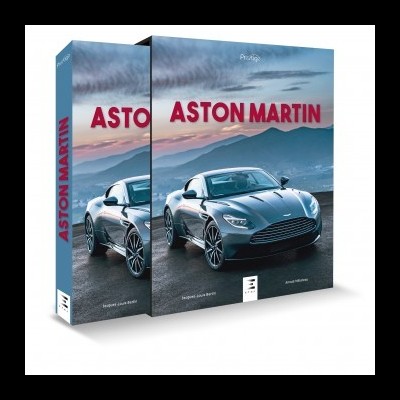 Caixa de livro com carro Aston Martin cinzento em estrada montanhosa