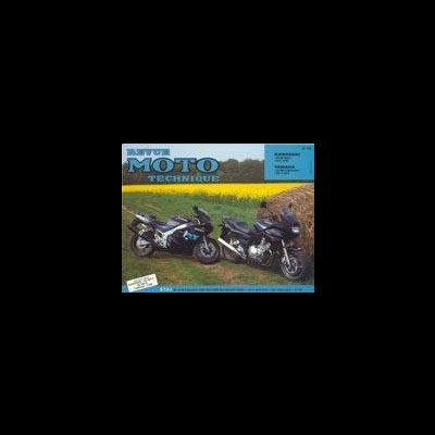 Revista com duas motos numa estrada de terra com campo ao fundo