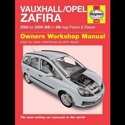 Capa de manual de oficina com carro prata e texto em vermelho.