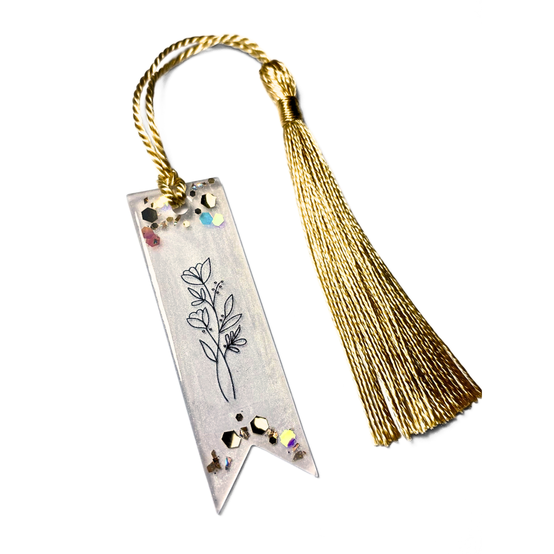 marcador de livros transparente com desenho floral preto e borla dourada