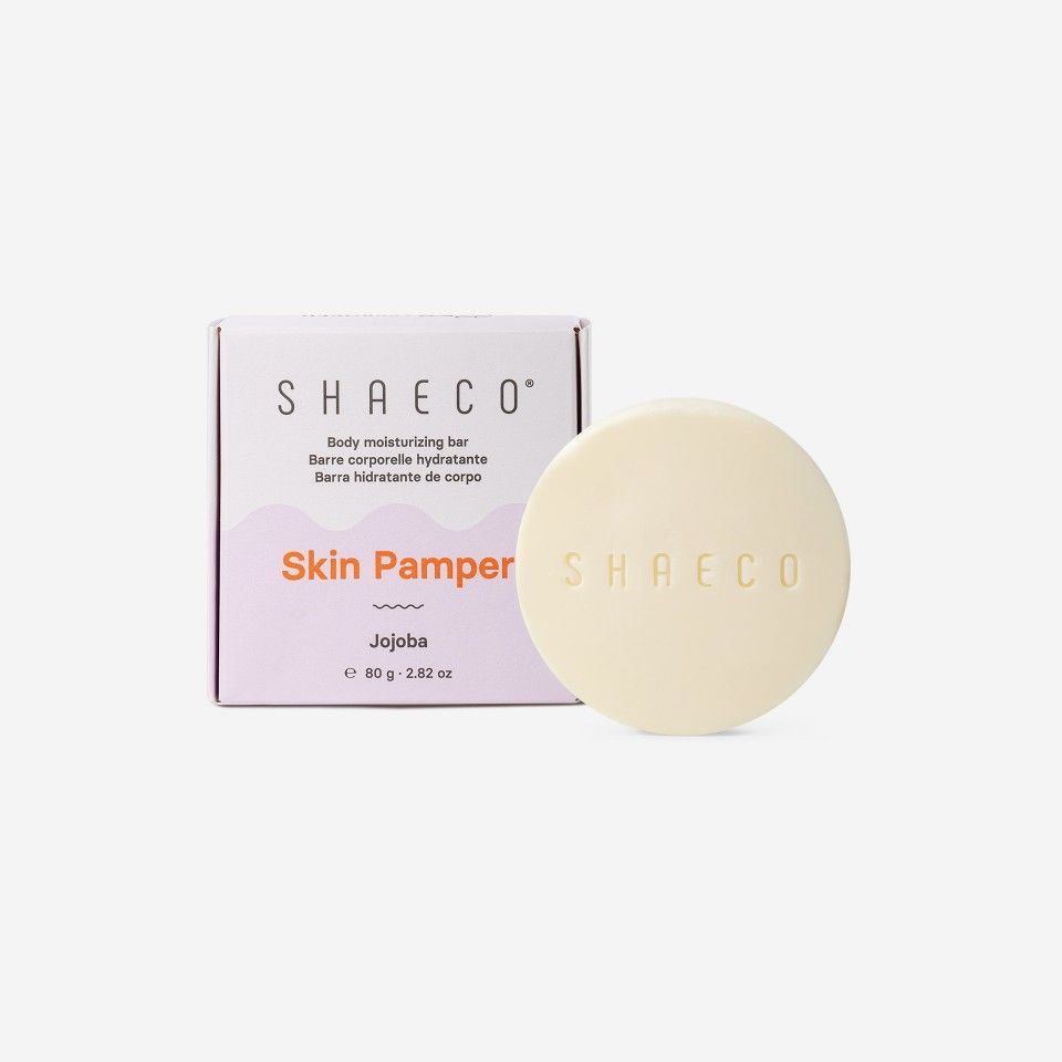 Barra hidratante corporal SHAeco Skin Pamper Jojoba com embalagem e barra creme