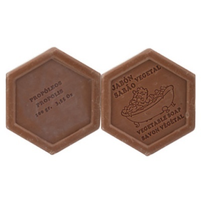 Duas barras hexagonais de sabão castanho com texto e ilustrações