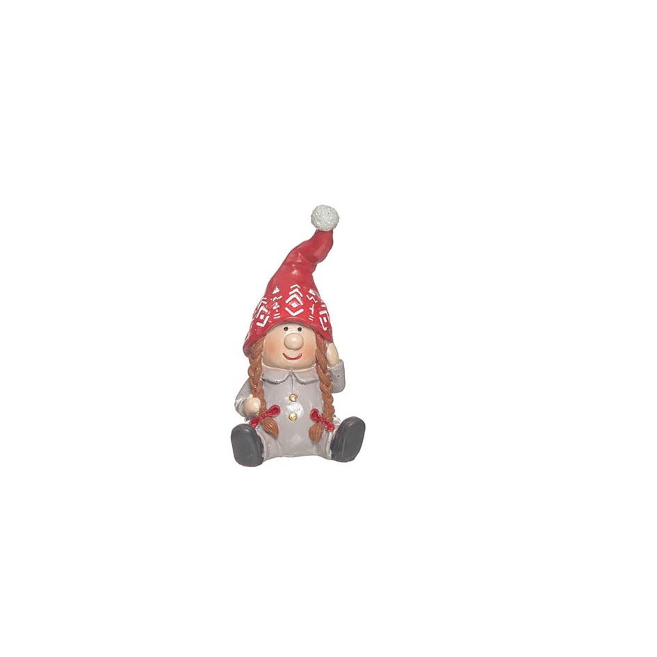Figura decorativa de criança com chapéu vermelho e pompom sentada