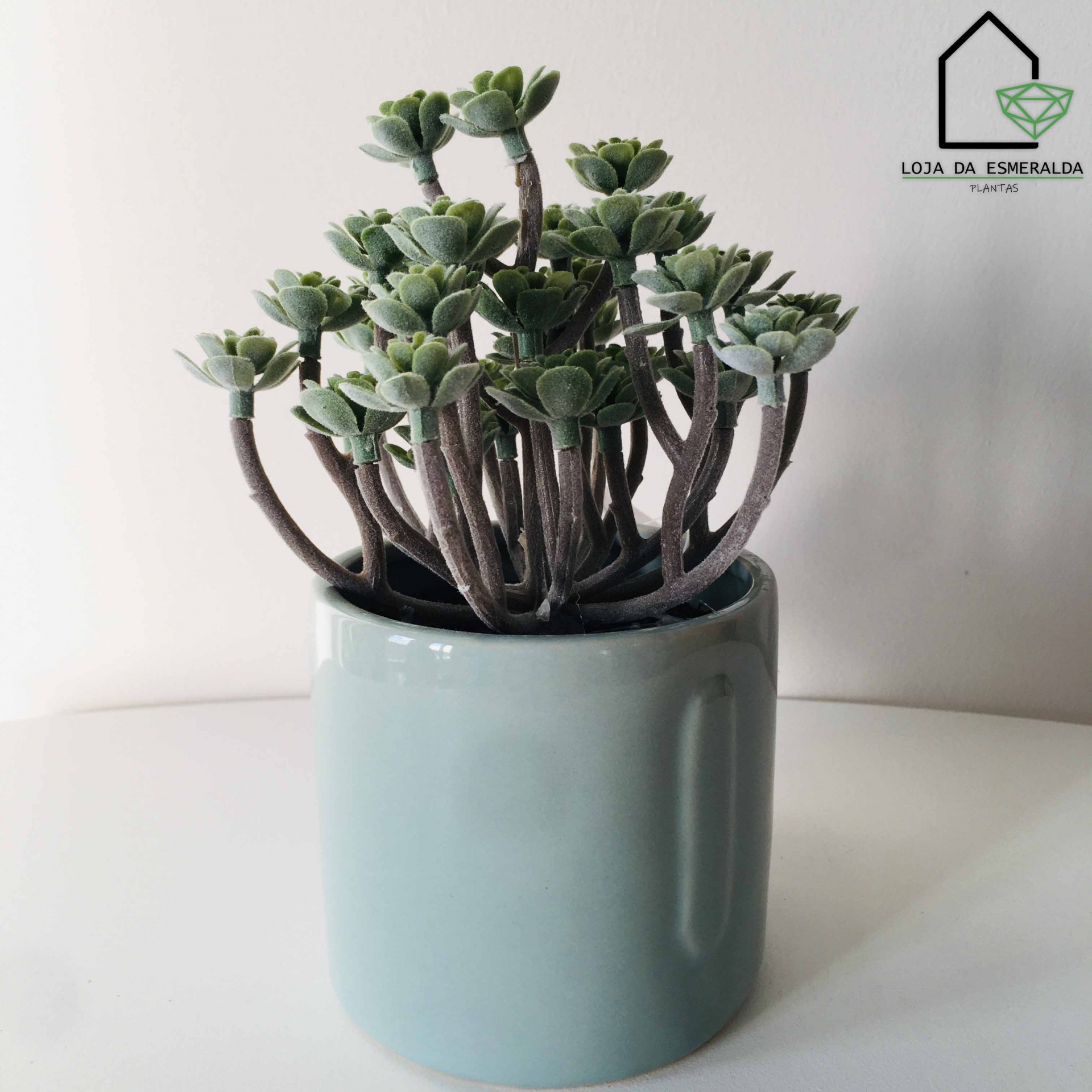 Planta suculenta artificial em vaso cerâmico azul claro