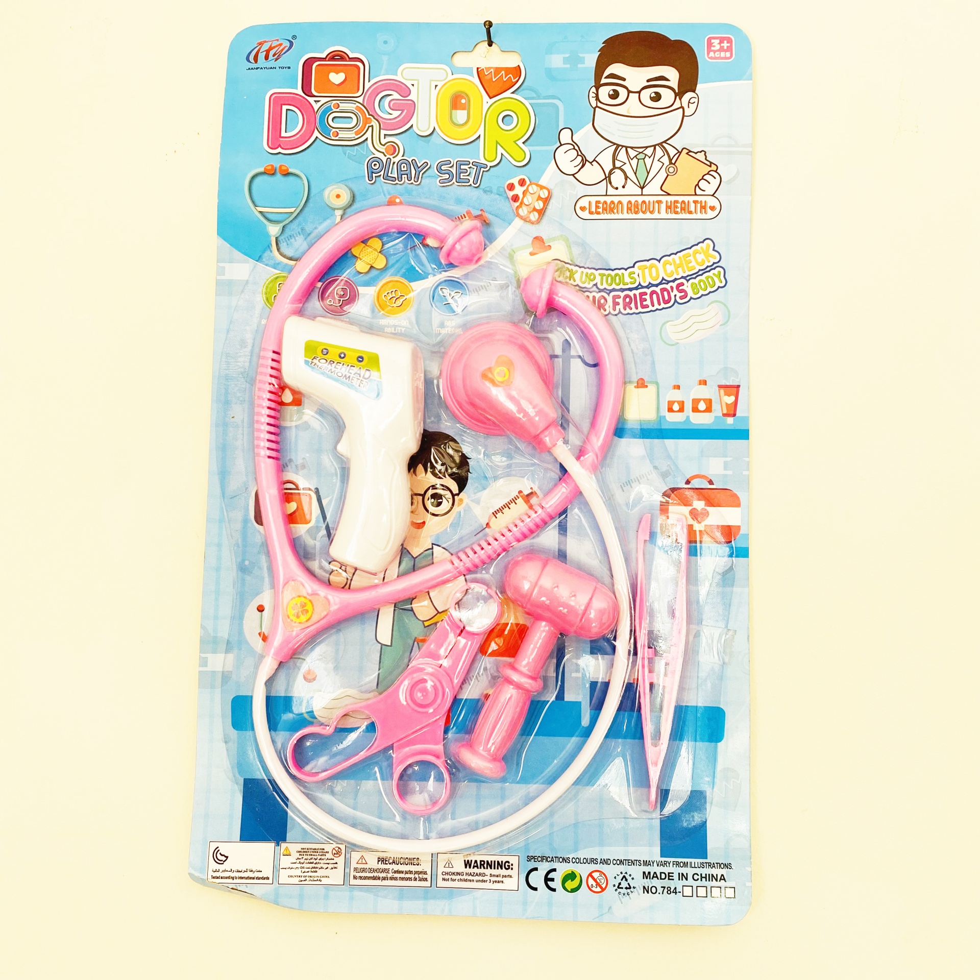 Conjunto brinquedo médico com acessórios cor-de-rosa e branco em embalagem blister azul