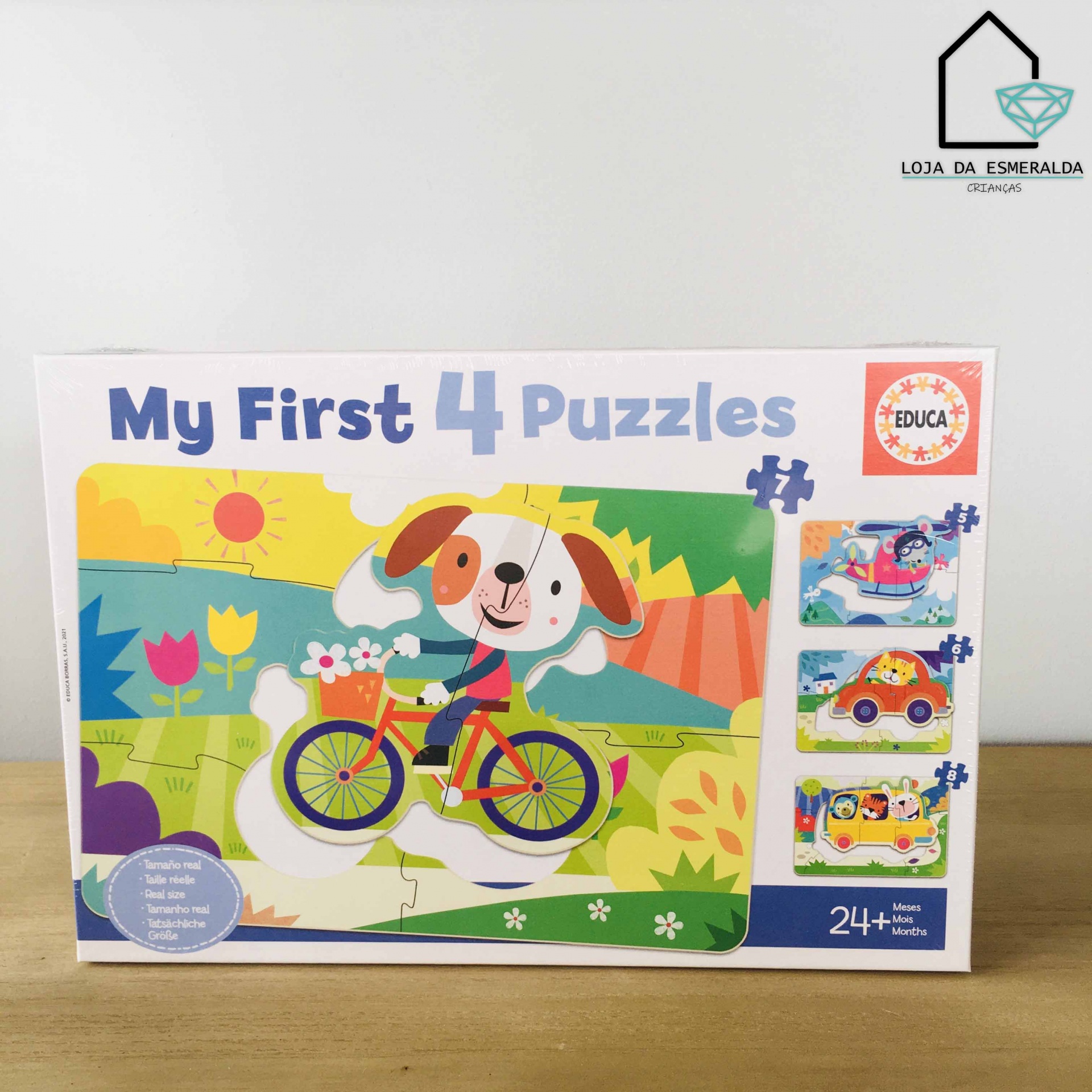 Caixa de 4 puzzles infantis da EDUCA com ilustração de cão numa bicicleta